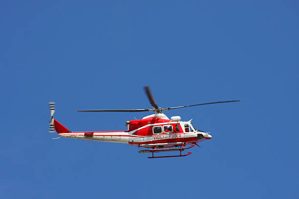 istock patrol helicopter of firefighters in blue sky over a fire 178713407