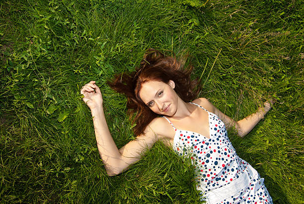 istock Woman looking happy and smiling on grass 178713871