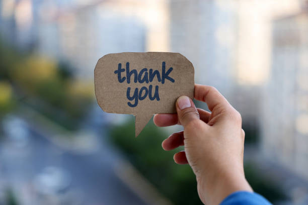 Thank you writes on the chat bubble stock photo