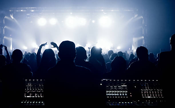 istock Silhouettes of people, watching a bang on stage 178714347