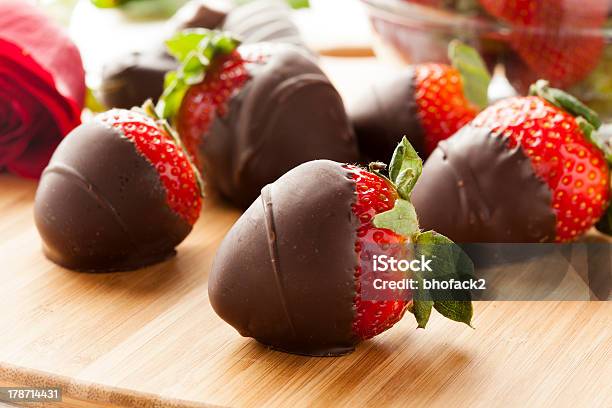 Dark Chocolate Covered Strawberries Lying On A Cutting Board Stock Photo - Download Image Now