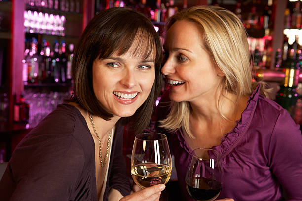 istock Two Women Enjoying Drink Together In Bar 178715590