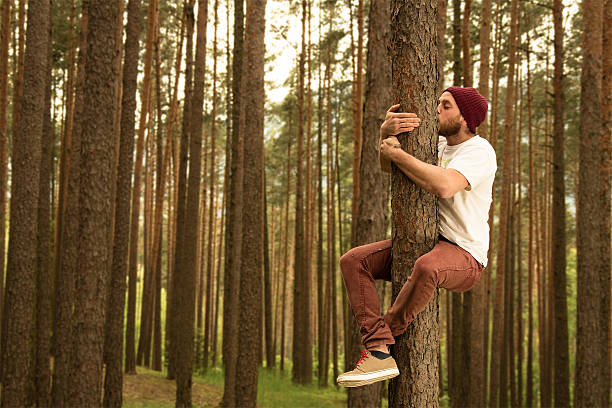 Tree Hugger Hugging trees because they do so much for us environmentalist stock pictures, royalty-free photos & images