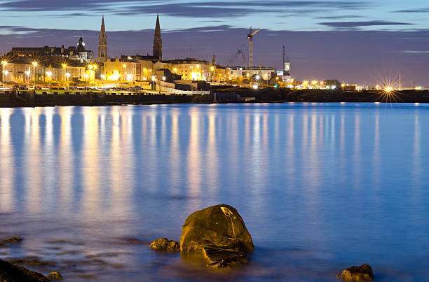 istock seaside town lights reflect off the sea. 178716609