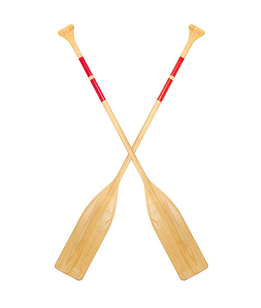 istock Two crossed wooden paddles on a white background 178716825