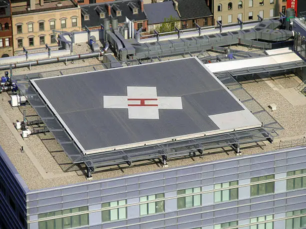 looking down on a rooftop landing pad