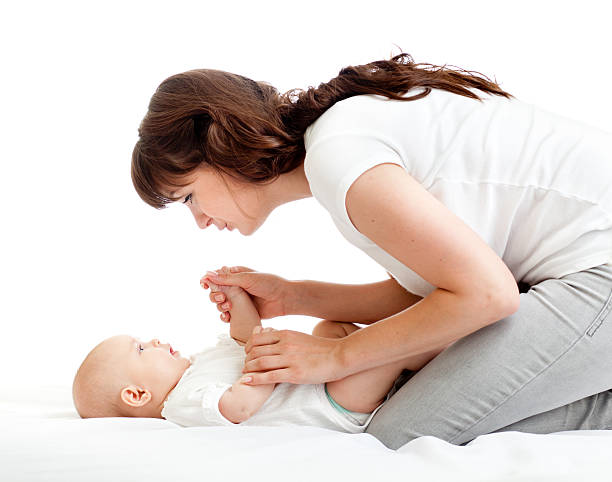 istock joyful mother playing with her baby infant 178717341