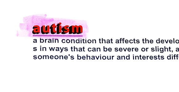 English definition of the word autism, a type of mental disorder, highlighted in red on a white background, psychology and psychiatry