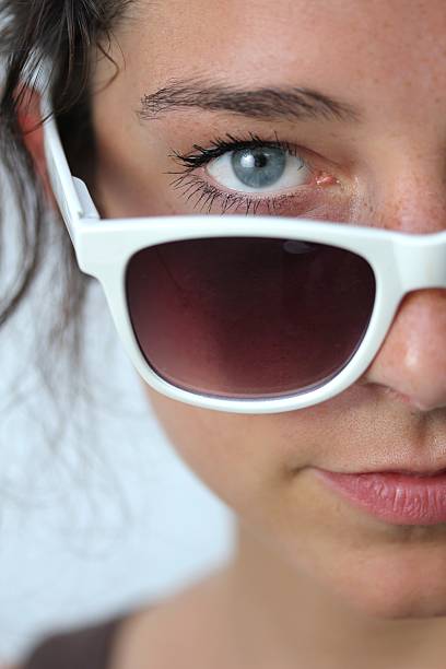istock young woman with sunglasses 178718410