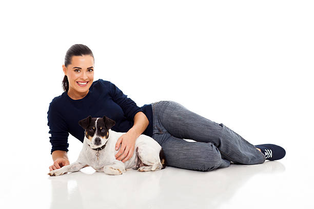 istock young woman lying with her dog 178718473