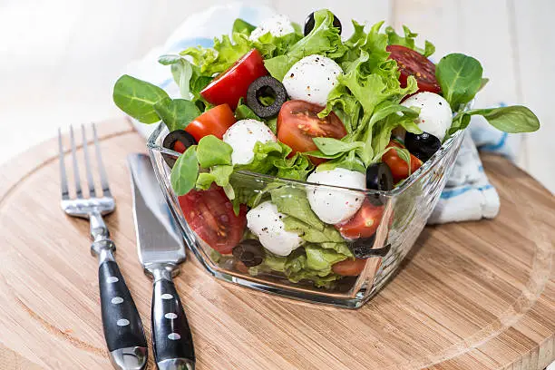 Portion of fresh and healthy Tomato-Mozzarella Salad