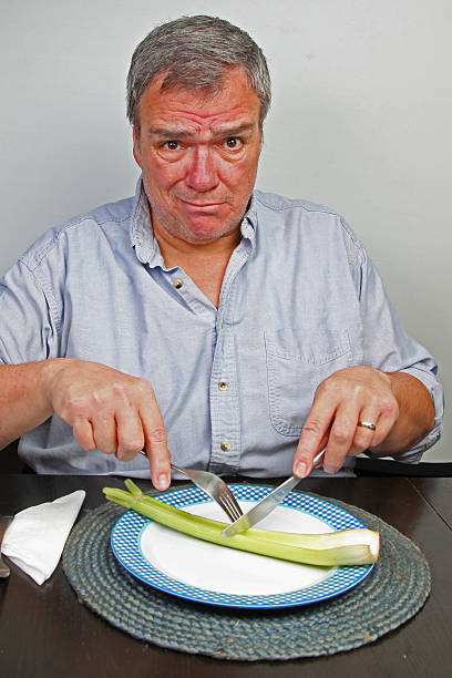 Overweight Man Attempts Drastic Diet stock photo