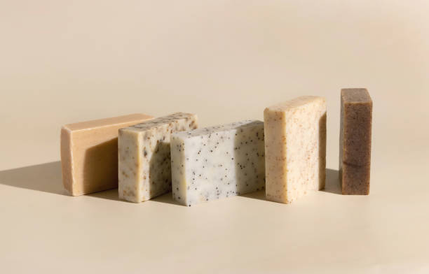 istock Natural herbal beige and brown soap bars on light beige close up, hard shadows 1787201056