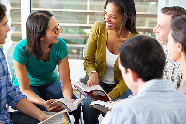 istock Group of young people gather for a bible study 178720179