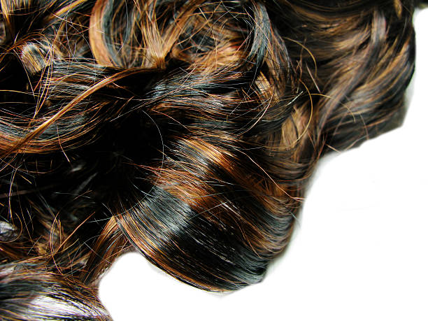 istock dark curly highlight hair texture background 178720274