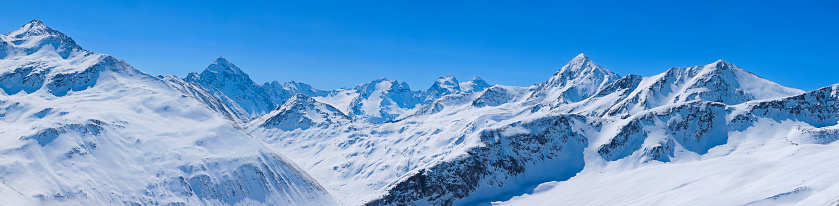 Perfect ski slope. Back country skiing. High mountain  landscape  At the top. Italian Alps  ski area. Panoramic  Ski resort Livigno. italy, Europe. Ski opening.