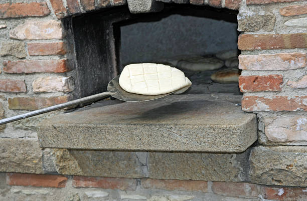 istock loaves of leavened bread ready to be fired by Baker 178720444