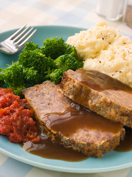 istock Mama's Meatloaf with Mashed Potato Broccoli Tomatoes and Gravy 178721143