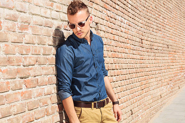 istock casual man with back to a wall 178721337