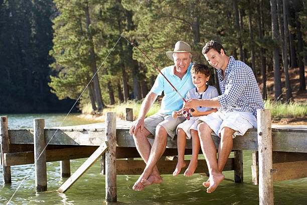 pai, filho e neto de pesca juntos - fishing active seniors family senior adult - fotografias e filmes do acervo