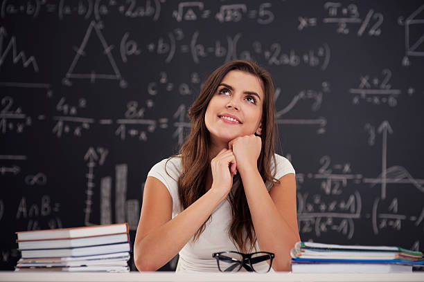 istock Happy woman sitting in classroom and looking up 178721811