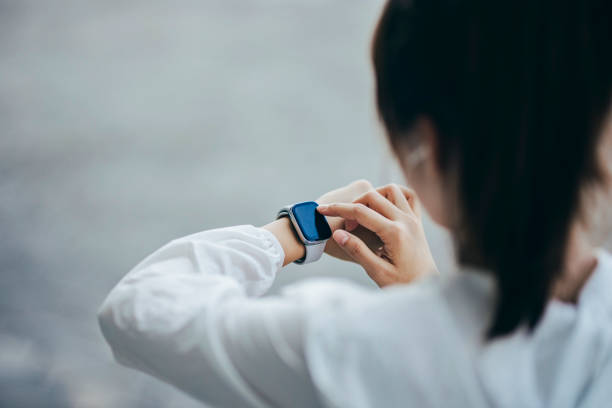 istock In the park, an Asian women engage in physical activities while utilizing smart devices to monitor their body data. 1787218175