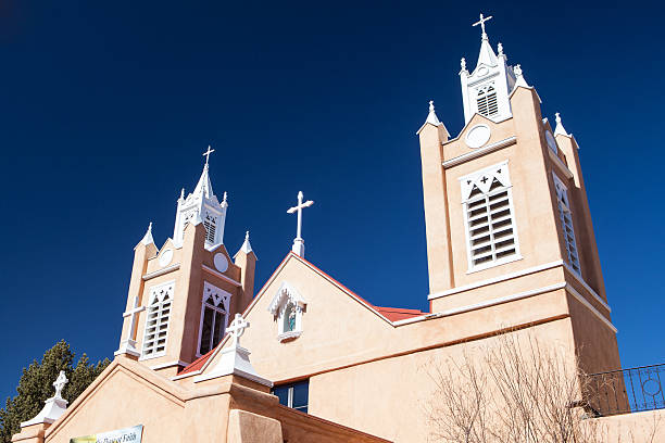San Francisco de Asis Mission Church is historic building on the main plaza of Taos, NM.  Built between 1772 and 1816 represents the New Mexico Spanish Colonial Church. This angle of church has shadow and light in the winter making a unique image.