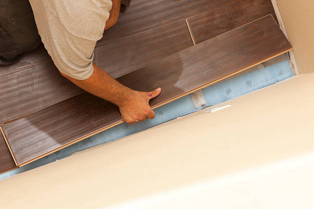 istock Man Installing New Laminate Wood Flooring 178722188