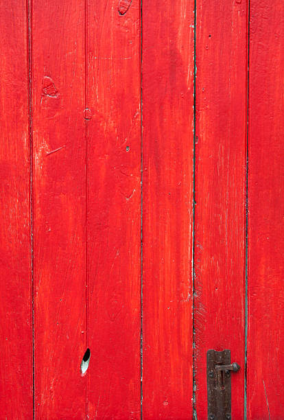 istock Handmade red painted wooden door with old lock 178722423