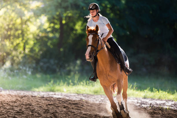 istock woman riding a horse 1787226564