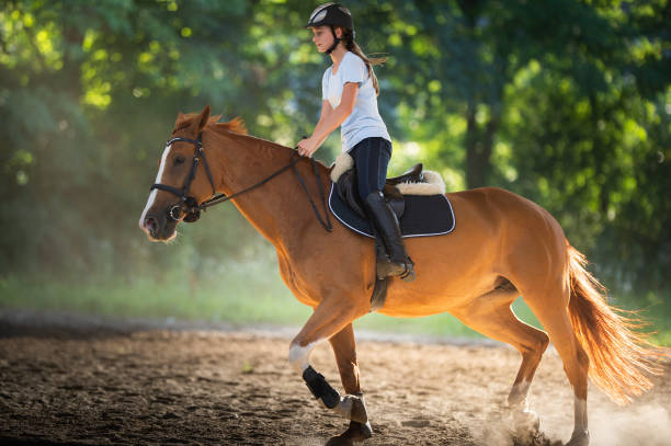 istock woman riding a horse 1787227149