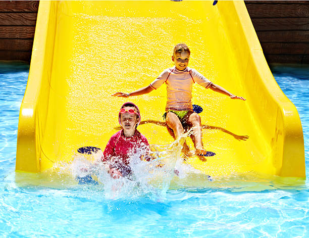 istock Children on water slide at aquapark. 178723104