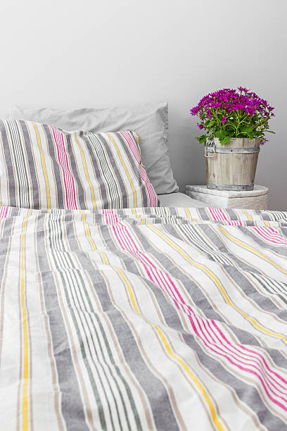 istock Bright bedroom decorated with purple flowers 178723711