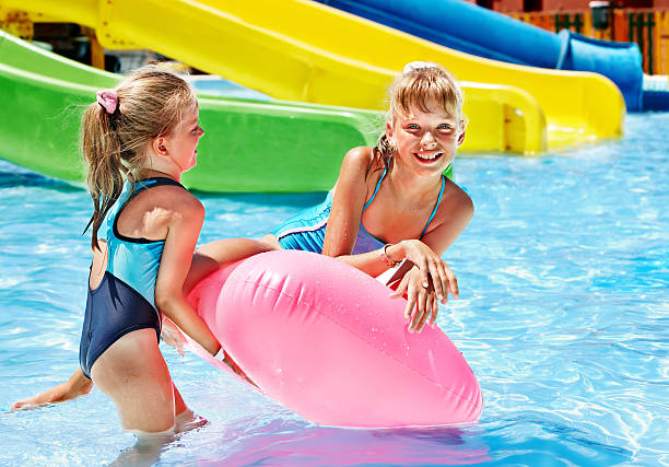 istock Child on water slide at aquapark. 178724639