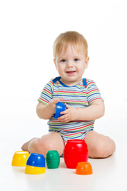 istock baby or kid playing with toys isolated over white 178724954