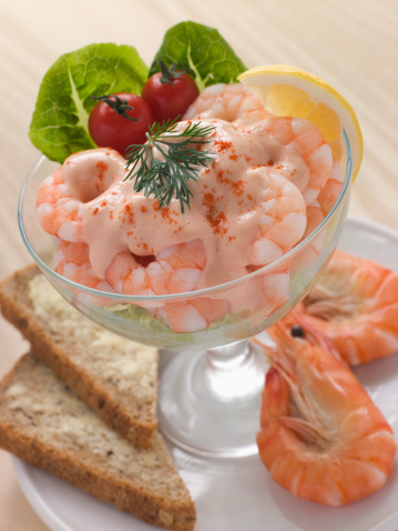 Food, salad and above of shrimp on plate for lunch, supper and meal preparation on white background. Ingredients, dish and top view of cuisine, dish and seafood for wellness, dinner and healthy diet