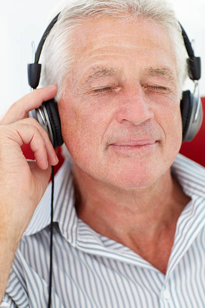istock Senior man with headphones 178725958