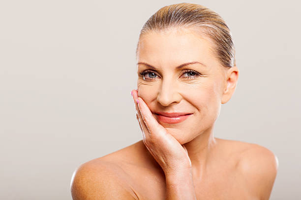 istock modern senior woman with hand on her face 178726087