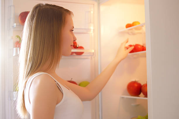 istock girl near the refrigerator 178726746