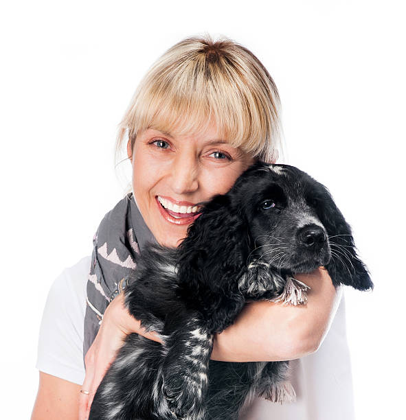 istock cocker spaniel and young woman 178727068