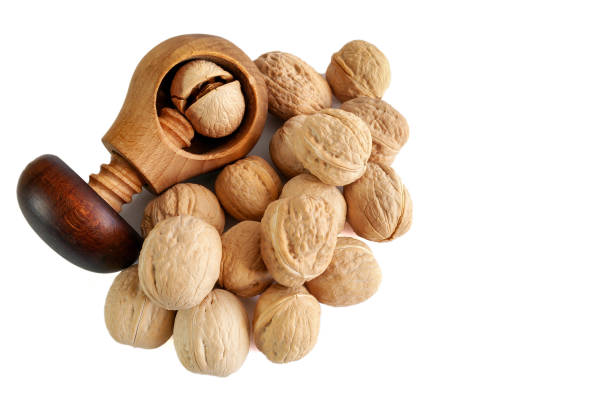 istock Whole and cracked walnuts isolated on white background 1787273038