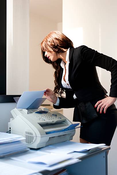 istock young business woman holding documents on office background 178727375