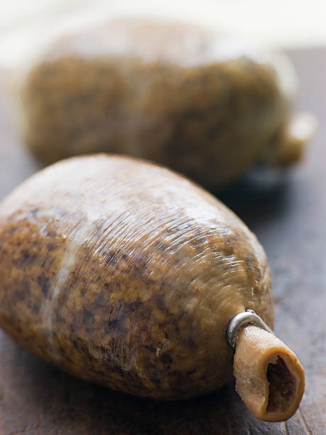 Whole Haggis on a Chopping Board Close up of Whole Haggis on a Chopping Board haggis stock pictures, royalty-free photos & images