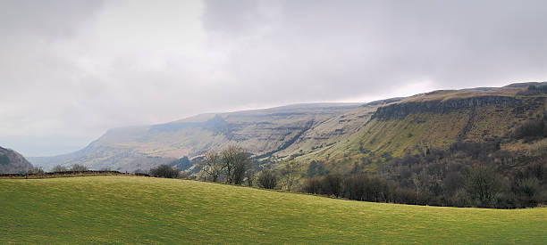 Mountain panorama of the Glenariff forest park Mountain panorama of the Glenariff forest park. Early spring at North Ireland, UK glenariff photos stock pictures, royalty-free photos & images