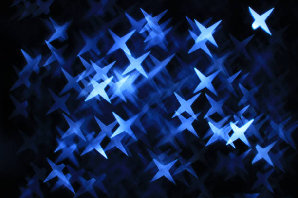 Abstract dark blue background with star-shaped boke effect