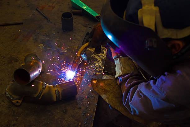 Welder "Welder weld metal ,photography" welding helmet stock pictures, royalty-free photos & images