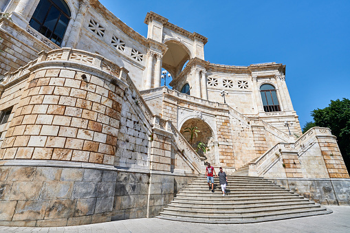 Cagliari, Italy - September 29, 2023: a couple visiting Saint Remy Bastion, a building built in classic style between 1896 and 1902 on the old city's medieval bastions.