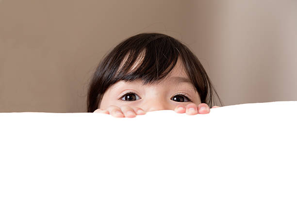 istock Big Beautiful Eyes Peeking Over White Copy Space 178729387