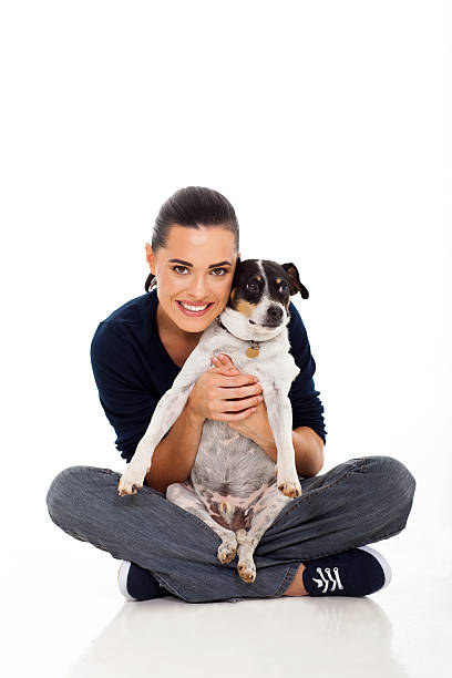 istock attractive young woman holding her dog 178729653