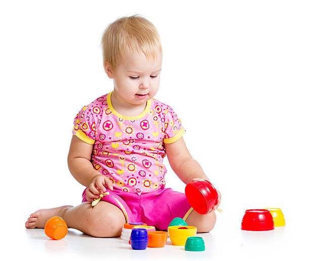 istock child girl playing with cup toys 178730492